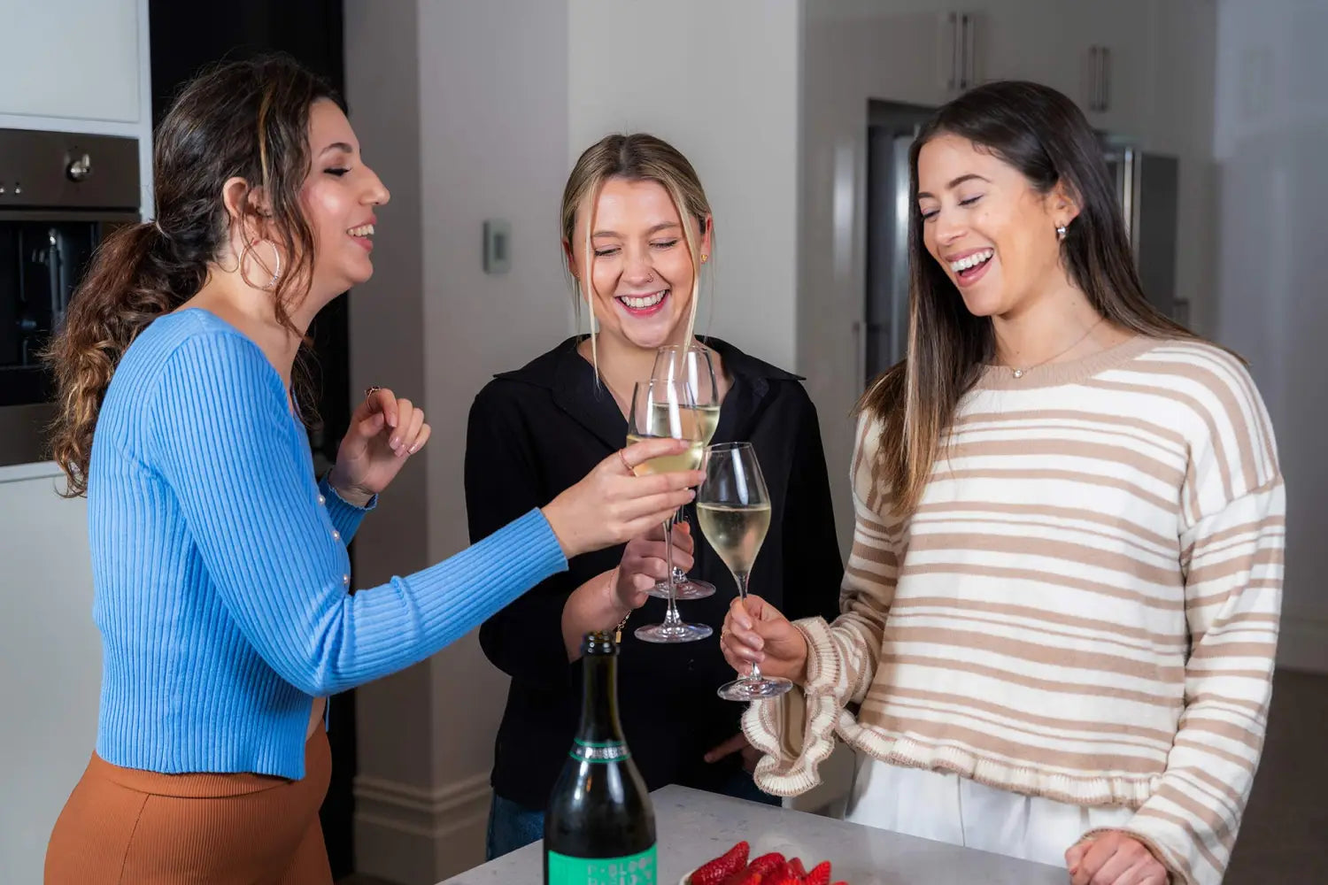 Group of females enjoying white wine